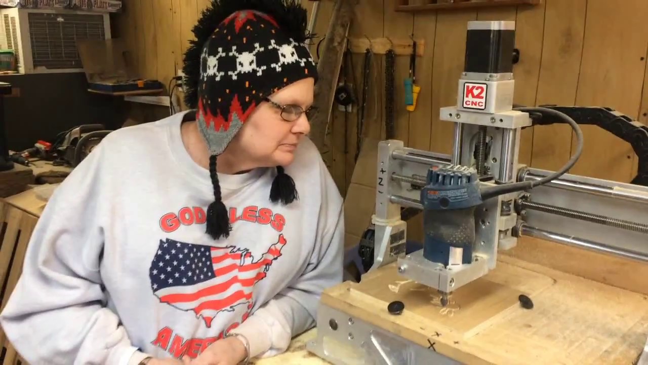 Wench Lori Watches the CNC Machine Engrave one of her Original Drawings
