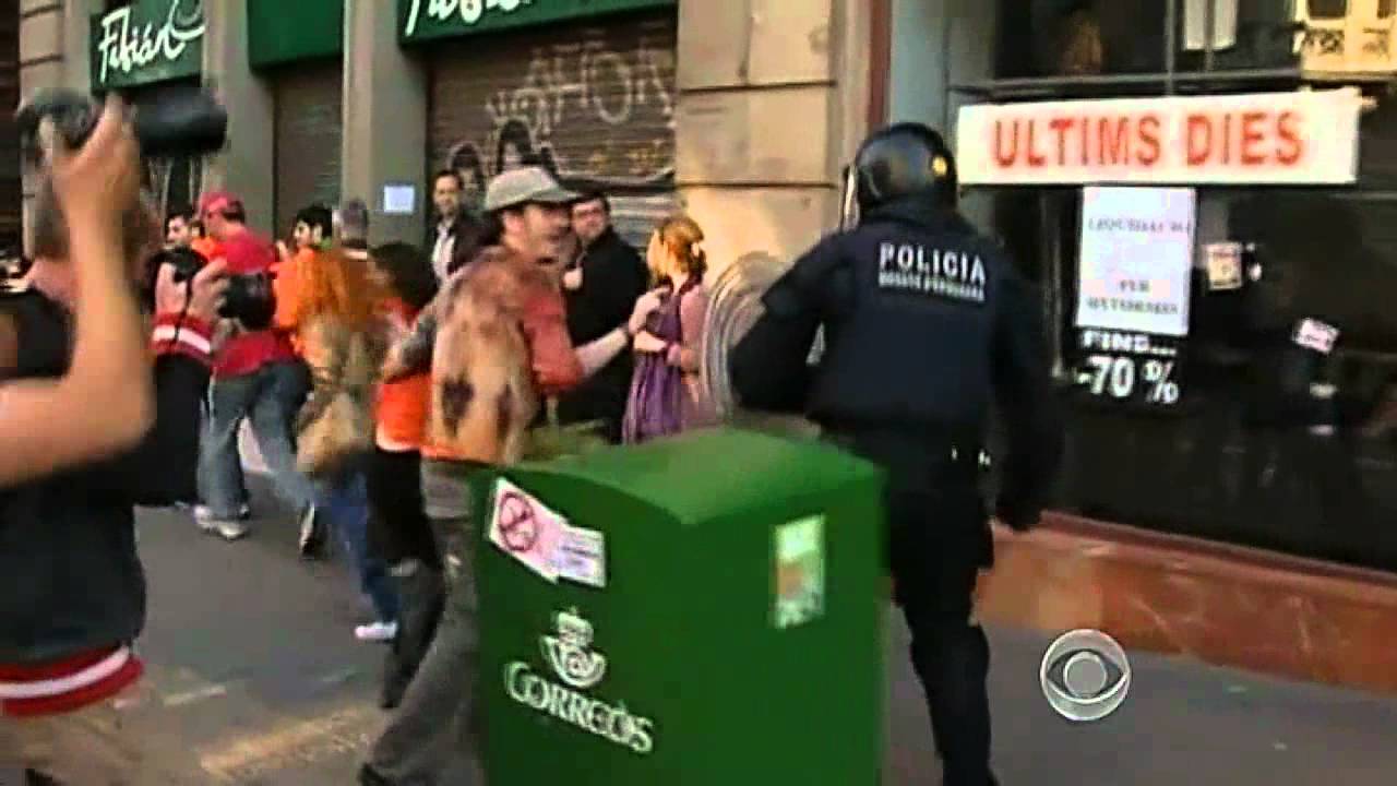 Police clash with protesters in Spain