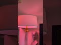 Pink light and a statue of a lady