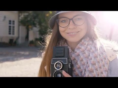 girl-preparing-camera-for-shooting-stock-video