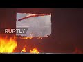 Nagorno-Karabakh: Residents burn homes before Azerbaijan obtains territory