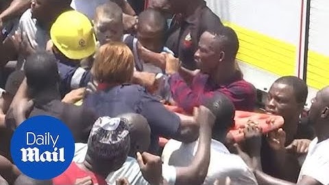 Children pulled from rubble of three-storey building in Nigeria