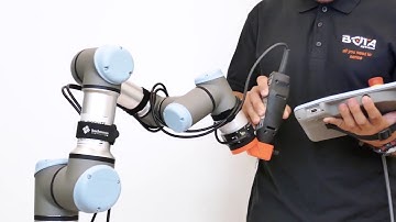 SensONE 6-axis force torque sensor hand guiding a UR | Bota Systems