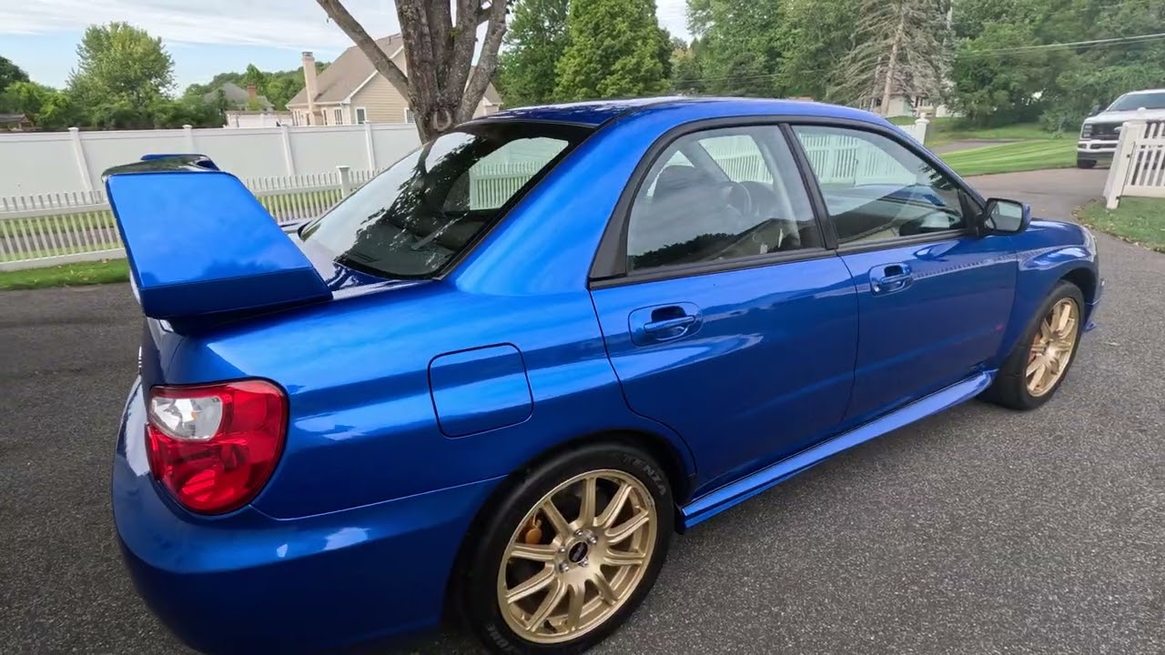 2004 Subaru Impreza WRX STi with 18k original miles in World Rally Blue Pearl with Gold Wheels