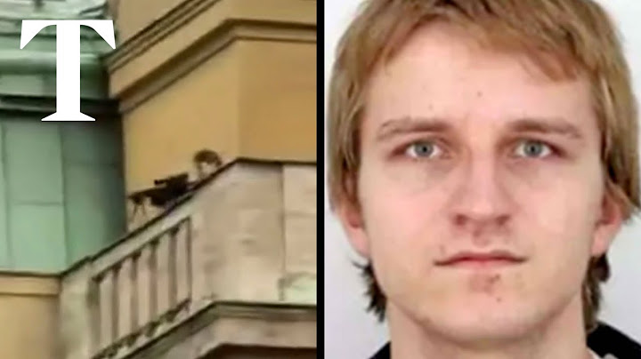 Moment Prague gunman fires from rooftop during mass shooting