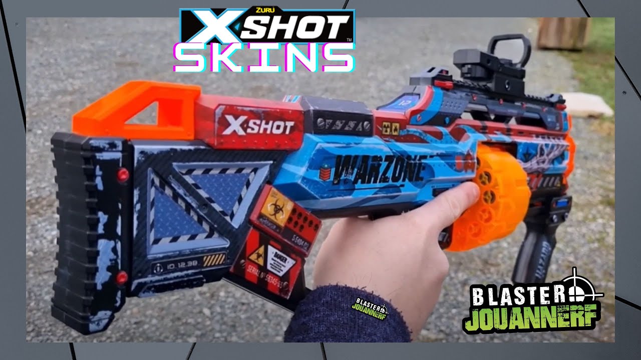 XShot Skins Last Stand – Blaster à Fléchettes à Impression Peau, Chargeur Tambour 14 Fléchettes, Portée 27 M, Mode Slamfire, 16 Fléchettes Incluses