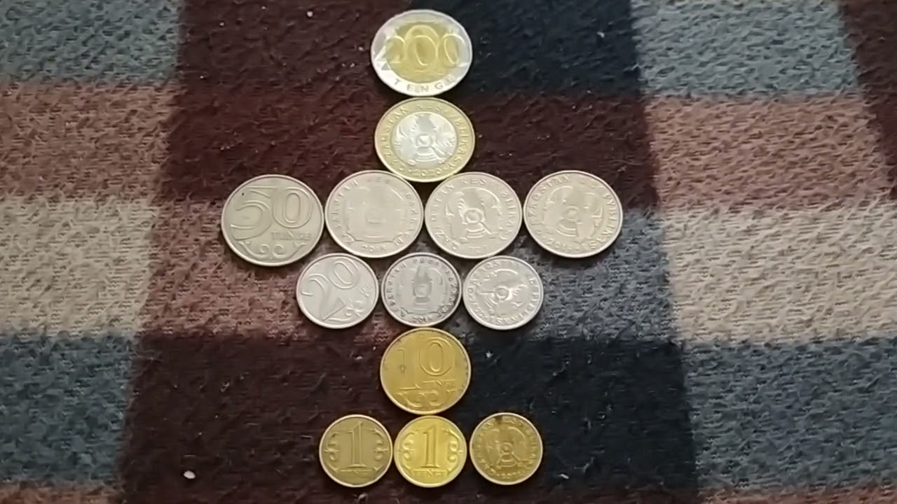 МОНЕТЫ: 1 по 200, 1 по 100, 4 по 50, 3 по 20, 1 по 10 и 3 по 1 ТЕНГЕ лежат на байк поверх 21 Декабря