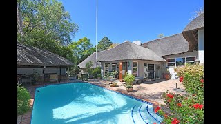 For Sale Magnificent, Stately Thatch Home on 1/2 acre stand on the border of  Bryanston