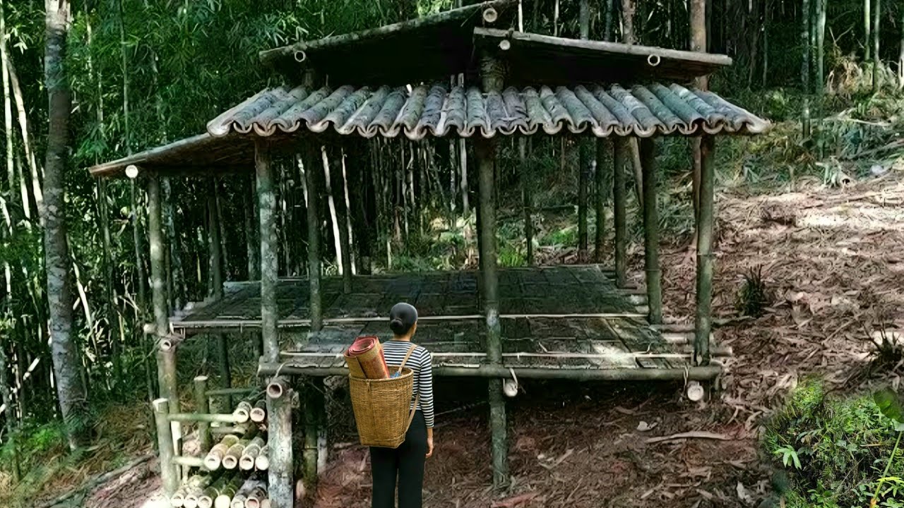 The young girl built herself a bamboo house in the deep forest. - YouTube