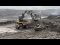 Liebherr r 9350 excavator loading on trucks 785 komatsu and oht 777d caterpillar  minining story