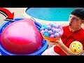 PUTTING 100 BATH BOMBS IN A 6FT WATER BALLOON!