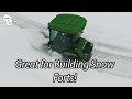 Not the fastest way to snow plow! But good for deep snow...the John Deere 60" Snow Thrower on a 1585