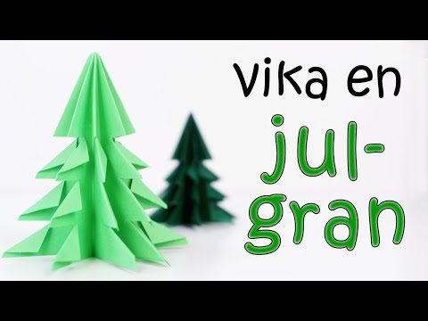 Video: Att göra en vacker julgran på väggen av glitter och kransar