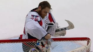 Braden Holtby Fixes His Mask During Play