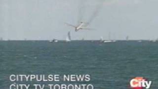 This is news footage of an airplane crashing at the toronto airshow
from mid 90's.