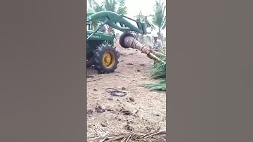 Máy cày john deere test thử xúc lật đi gắp cây dừa