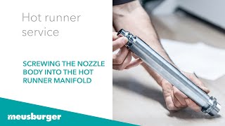 Screwing the nozzle body into the hot runner manifold - hot runner service | Meusburger