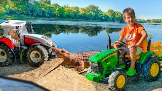 Darius saves the tractor from the lake full of reptiles | Tractors for kids