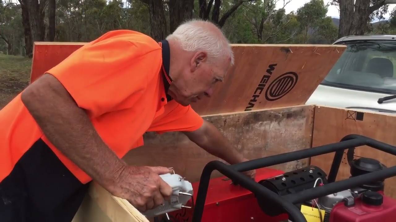 Unpacking a tracked remote controlled diesel flail mower/ mulcher