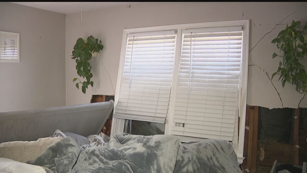 Canfield family displaced after car crashes through home - YouTube