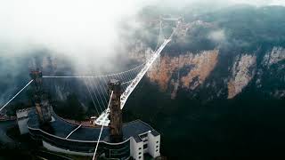 Breathtaking view of world's largest and highest glass-bottomed bridge amid the rain and fog