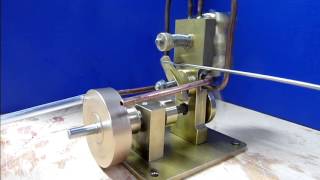 Double acting single cylinder oscillating steam engine