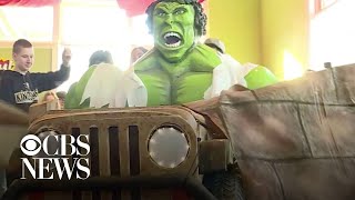 Volunteers build mobile "Hulk" Halloween costume for boy in wheelchair
