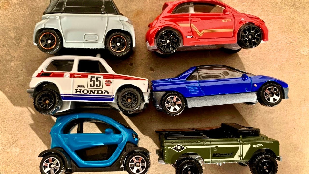 Small Diecast Cars in Car Carrier Honda N600, Land Rover Series II