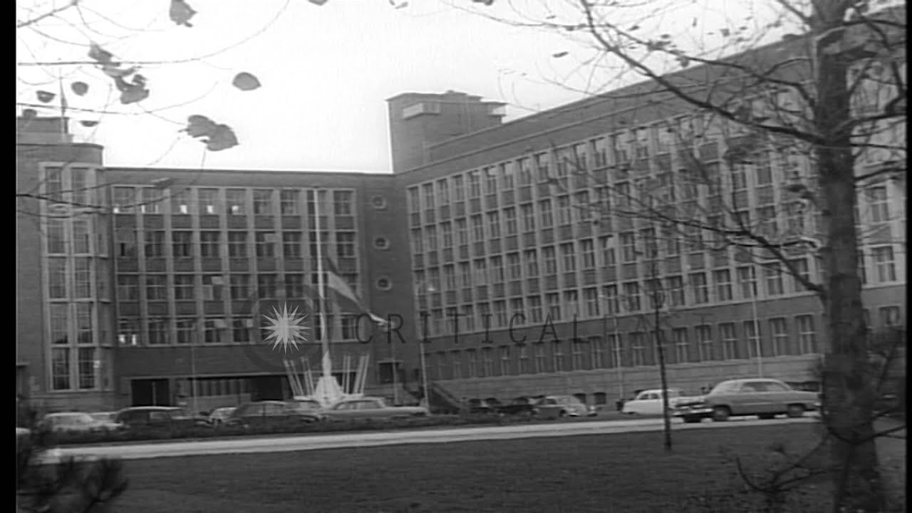 The Ministry of Foreign Affairs in Netherlands with half staffed flags. HD Stock Footage