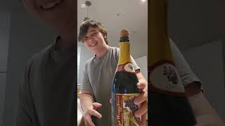 Damon tries sparkling grape juice 