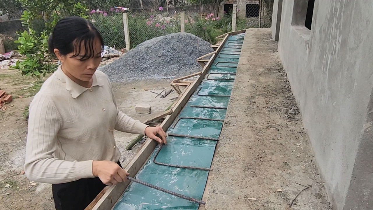 The girl widened the hallway and added iron bars to create a railing for her dream house.