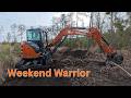 Hitachi 50 clearing and cleaning ditches