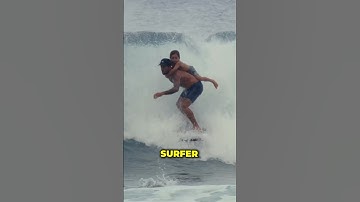 Thumbnail of Surfing with his son on his back!❤️😲