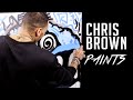 Chris Brown does spray paint art at HOT 97 studios?