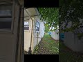 Lift off of house and trim back to property line.