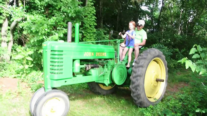 Eleanor drives the John Deere with Wendell Norwood