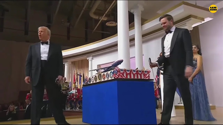Donald Trump dances with sword after he and JD Vance cut cake at Commander in Chief inaugural ball.
