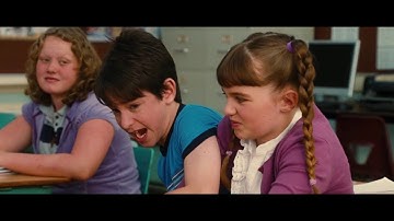 The boy grabbed seats with others at the first day of school, the boy was on the list of his teacher