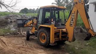 Jcb 3DX cleaning the agriculture land