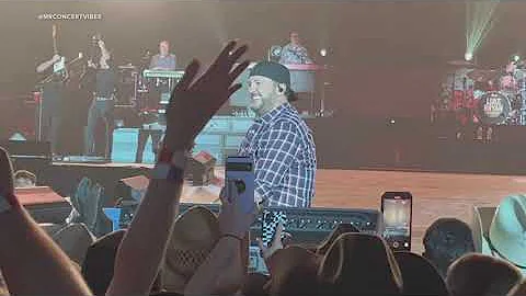 Luke Bryan brushes off onstage fall after slipping on fan's phone