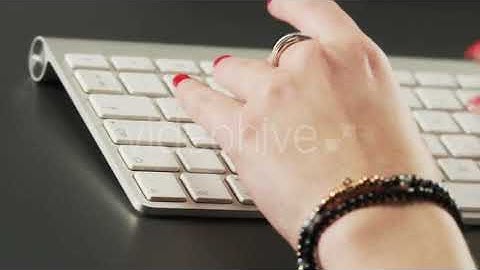 Woman Typing on a Keyboard and Using Mouse | Stock Footage - Envato elements