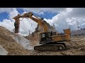 Rock drill and splitter attachments mounted on excavators