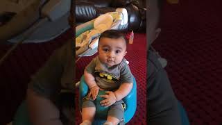 Guy throws American cheese at baby seated in baby chair