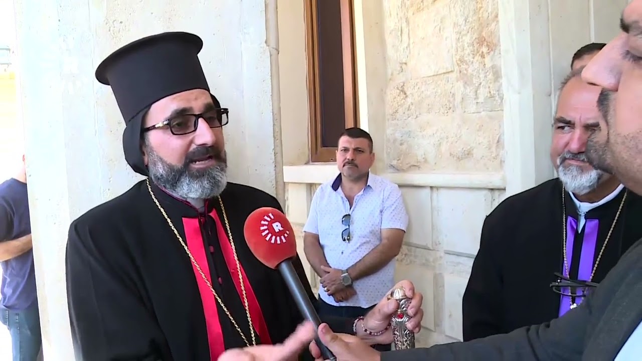 المسيحيون يهددون باعتصام مفتوح ما لم يحاسب المتورطون بحريق الحمدانية