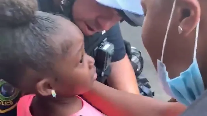 Worried Little Girl Gets Reassured by Police Officer During Protest in Houston Texas.