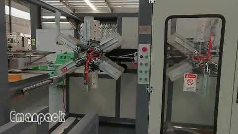 Automatic hose coiling machine with automatic coil strapping machine integration