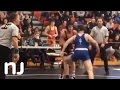 High School wrestler disqualified after punching opponent, pushing him into scorer's table