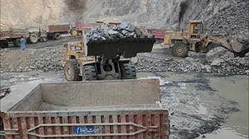 Cat-966D Vs Cat-966E: Wheel Loaders Loading Massive Rocks into Trolleys