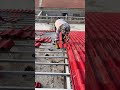 The process of installing metal patterned roof tiles on the roof of a light steel frame building