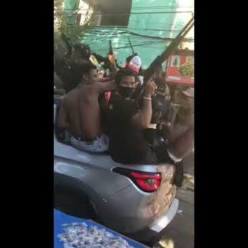 Armed Gang Members Strolling Through the Brazilian Slums